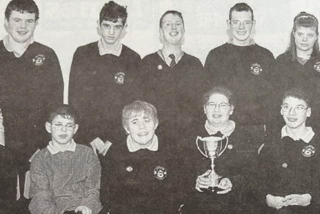 Teacher, O. Erskine and pianist Karen Logan with pupils from Loughan School who won the Wallace Cup at Ballymena Festival.
2000