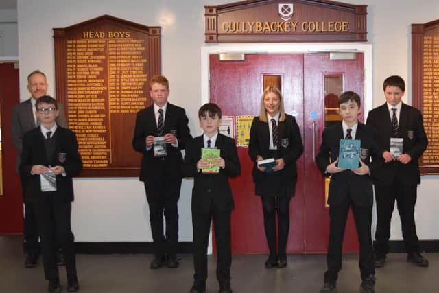 Year Nine pupil Ewan Clarke (front fourth from left) won third prize in the UK, which included book prizes for himself and £100 for the school. Other pupils including Harvey Hull  9A1, Marc Gordon  9A5, David Mark  10A4, Samuel Hanna  11A1, Emma Glendinning  11A2 and Jacob McKinney  9A2  received book prizes to acknowledge their excellent standard of work.