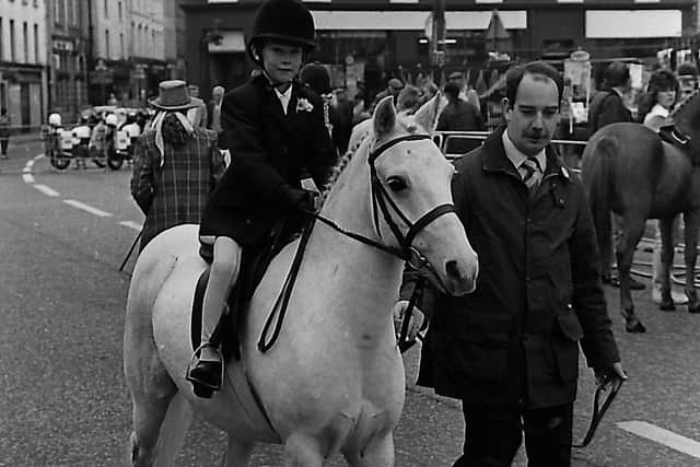 Lynne McCormick, seven, and her dad Robert put Cindy Sue through her paces at the seventh annual Dromore Horse Fair which was held in the Co Down town in October 1989. Picture: Trevor Dickson/News Letter archives