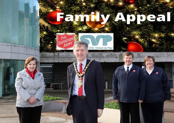 Causeway Coast and Glens Mayor, Mark Fielding helps launch the Salvation Army and St Vincent de Paul Christmas Family Appeal with Lieutenant Timothy Cooke, Major Jane-Marie Cook and Anne Irwin. WK48-02TM