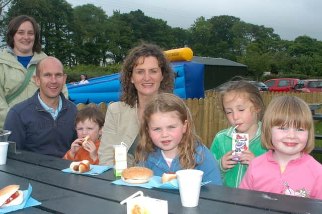 This family are enjoying their burgers at the Cairncastle Presbyterian Church fund raising event at Carnfunnock. LT23--014 PSB
