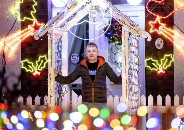 Jordan Christie from Ballybogey at his home which has been decorated for Christmas in aid of NI Children's Hospice