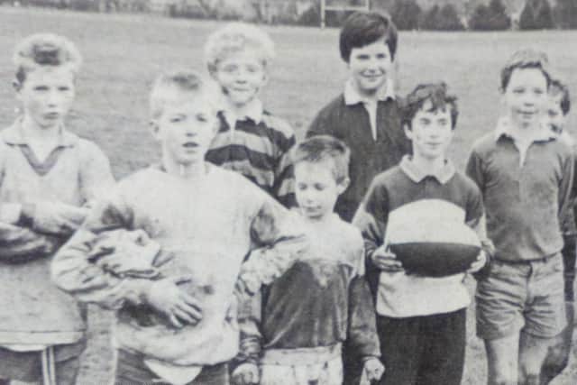 Youngsters pose for a picture after their mini rugby training session at Eaton Park. 1989