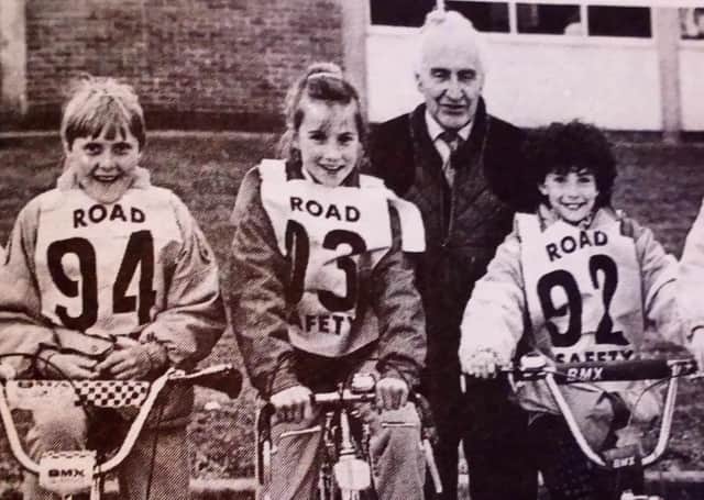 Ken McKee (chair of Ballymena Road Safety Committee) with some of the competitors in the annual Cycling Proficiency Competition at Dunclug High School.1989
