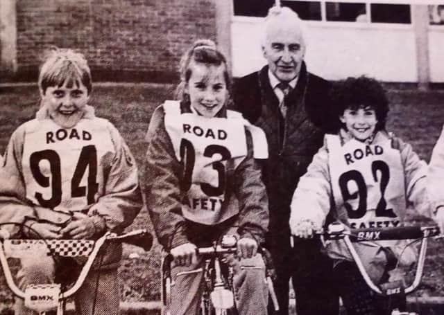 Ken McKee (chair of Ballymena Road Safety Committee) with some of the competitors in the annual Cycling Proficiency Competition at Dunclug High School.
1989