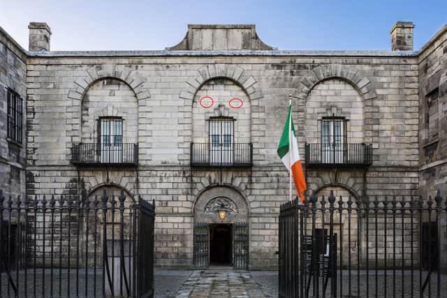 Front facade of the Gaol where public executions took place - approximately 140 public hangings from 1796 to 1868. The beams of the scaffold would have been located above the upper middle window, in the areas highlighted in red.  Photograph by PM Photography, courtesy of Kilmainham Gaol Museum, Dublin.