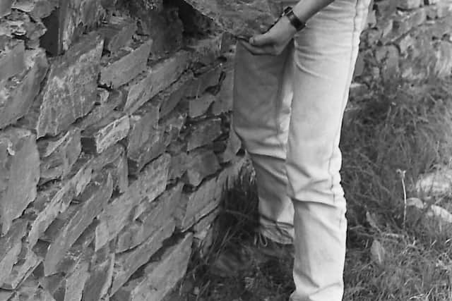 Back-breaking work for George Graham from Downpatrick in October 1989 as he helps to put the finishing touches to one of the stone walls at the Ulster Wildlife Trust's nature centre at Crossgar, Co Down. Picture: News Letter archives