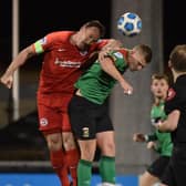 Glentoran's Andrew Mitchell and Larne's Albert Watson during  the final at Seaview.
Pic Colm Lenaghan/Pacemaker