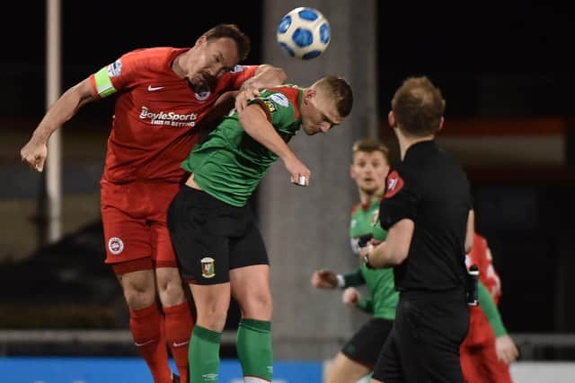 Glentoran's Andrew Mitchell and Larne's Albert Watson during  the final at Seaview.
Pic Colm Lenaghan/Pacemaker