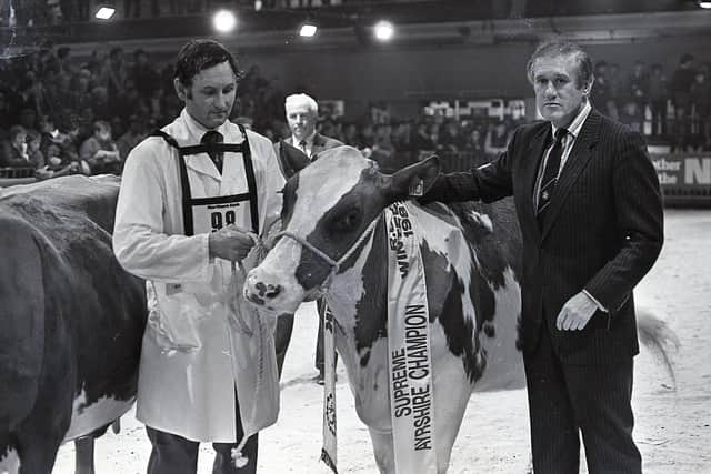 John Hunter from Crumlin, the exhibitor of the Ayrshire champion at the 1987 Winter Fair at the King's Hall in Belfast receives his award from John Roberts, chief executive of the Northern Bank. Picture: Farming Life archives