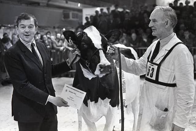 Northern Ireland farm minister Lord Lyell congratulates Robert Mulligan of Banbridge on winning the British Friesian championship at the Royal Ulster Agricultural Winter Fair in December 1987. The animal later went on to win the inter-breed championship – for the second year running. Picture: Farming Life archives