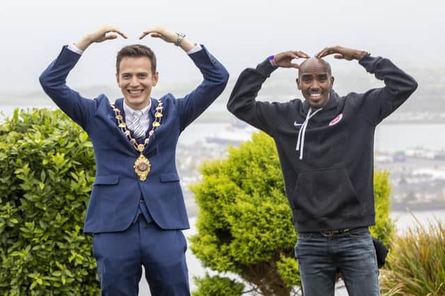 The Mayor of Mid and East Antrim, Councillor Peter Johnston, with Sir Mo Farah at this year's Antrim Coast Half Marathon.