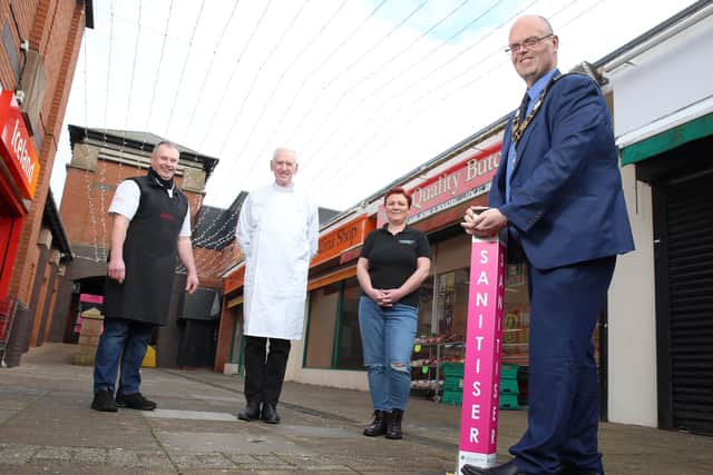 Mayor of Antrim and Newtownabbey, Cllr Jim Montgomery launches the new sanitizer stations across the borough's town centres with Alistair (Tramway Butchers), Dr Lawrence McGrath (Torax) and Janine (Décor Interiors).