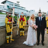 Lauren and Jason Chambers pictured with Portrush RNLI crew members from left, Johnny Weston, Andy McClelland, Tim Nelson and Lisa Abernethy. Wedding photo courtesy of Mairéad McDaid (Remain In Light Photography - www.remaininlightphotography.com).
