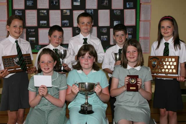 Academic prize winners who received their awards at the All Saints Primary School prize day. Back L-R, Sophie Loca, Aiden Loughran, Michael McQuillan, Ciaran Ferris, Helen Killough. Front, L-R, Naimh Reilly, Grace McGarry and Briget Keenan. BT25-113JC