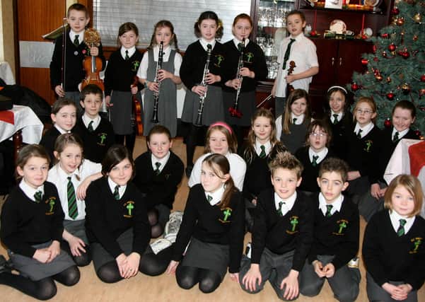 Pupils from All Saints Primary School who entertained staff and residents of Pinewood Residential Home. BT52-022JM.
