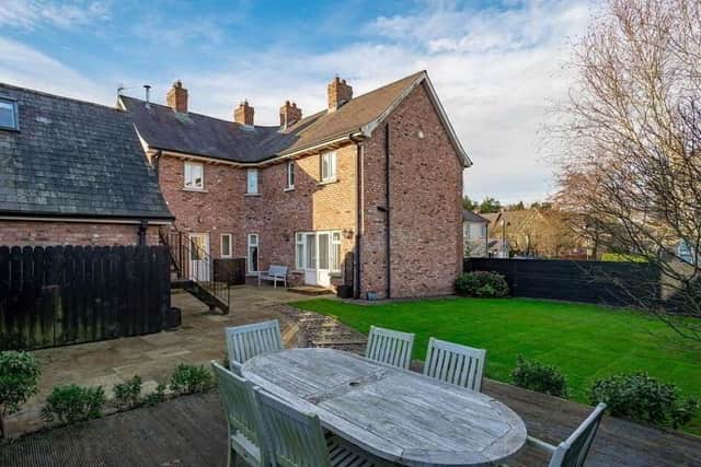 The property has  landscaped gardens in lawns with sleeper and pebbled path to raised deck sitting area and paved barbeque area