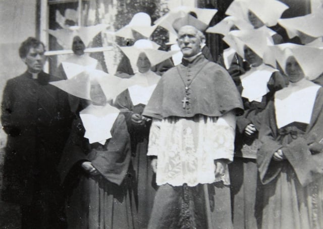 Pictured centre is Dr Daniel Cohalan, Bishop of Cork and Ross, with Sisters of Charity from Kinsale, Co Cork, and the Reverend Patrick MacSwiney CC, MA. Picture: Wikimedia Commons