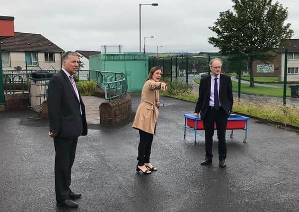 Education Minister Peter Weir with the Principal of Ballyclare Nursery School, Emma Corry and South Antrim MP Paul Girvan.
