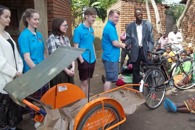 In Mwaliwa, a bicycle ambulance was welcomed by the villagers