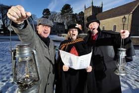 Carollers John Shepherd (left), Ruth Turkington and Victor Sloan (right), practice their favourite Christmas songs ahead of the Ulster Folk and Transport Museum's Spirit of Christmas Past in December 2010. Picture: News Letter archives