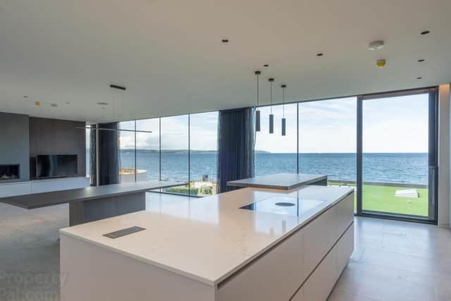The property has a kitchen/living area with complete glass frontage providing fabulous sea views