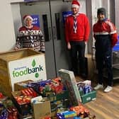 Fifth Ballymena Scouts festive support Foodbank
During these times of restrictions, the Fifth Ballymena Scout Group considered how they could still do their bit for the community this Christmas.
One very deserving charity that they all agreed to help was Ballymena Foodbank. For many reasons this Christmas will be especially challenging for a lot of local families in our community and the Explorers, Scouts, Cubs and Beavers of Fifth Ballymena were only too happy to do their bit and help out. The Group organised a socially distanced driveway food drop off and Leaders were delighted to see how the Christmas spirit was truly alive as the donations came pouring in throughout the day. Will McDonald from the Ballymena Foodbank chatted to them all during a Zoom meeting and explained the items they were especially in need of. Many of the members shopped for these items themselves and some even used their own pocket money. The donations were transported on to Ballymena Foodbank and when weighed by the charity totalled