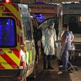 Medical staff attending to two patients in an ambulance, at Antrim Area Hospital, Co Antrim in Northern Ireland. PA Photo. Picture date: Tuesday December 15, 2020. Photo: Liam McBurney/PA Wire