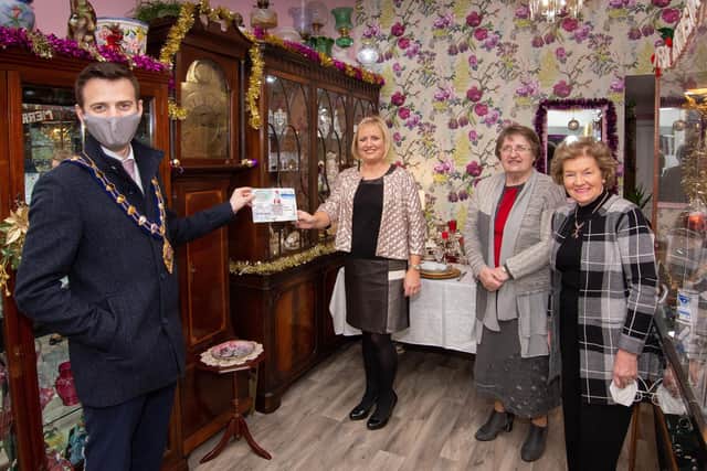 The Mayor, Councillor Peter Johnston, delivers his Christmas card to Cobwebs Jewellers and Antique sin Larne, included are Karen Mayne, Doreen Knox and Joan Bingham.