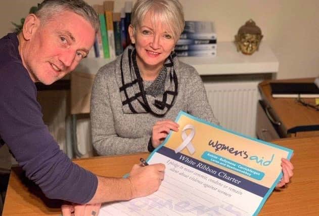 World Ju-Jitsu Federation Ireland joins with Women’s Aid ABCLN at The Dojo, Ballymena to sign the White Ribbon Charter making the pledge to never commit, condone or remain silent about violence against women. Pictured: Anne and David Toney from The Dojo, Ballymena