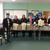 Principal Mr Marsh and Vice-Principal Madame Skobel pictured with students from 11GO who donated hampers of food to the local community as part of their Prince’s Trust course