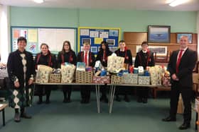 Principal Mr Marsh and Vice-Principal Madame Skobel pictured with students from 11GO who donated hampers of food to the local community as part of their Prince’s Trust course