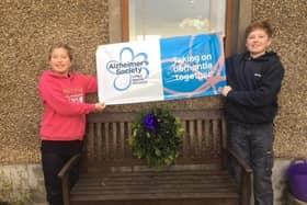 Harry and Molly Lyttle, from Kells, celebrate raising £745.05 for Alzheimer’s Society by creating Christmas Wreaths for their friends and family.