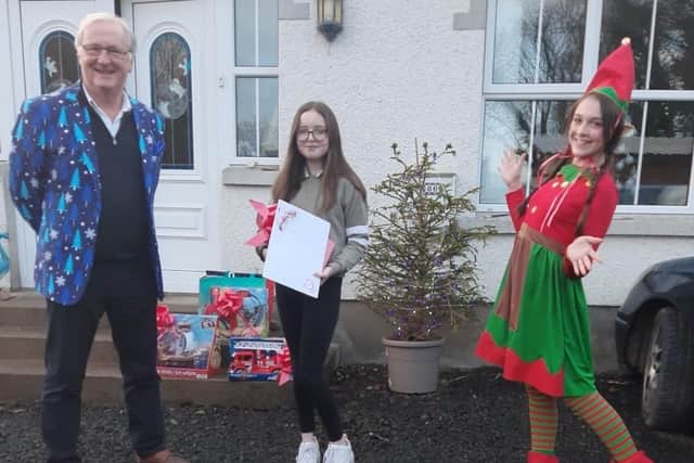 Pictured are Colin Barkley Chairman NICLT, Grace McErlean (12), and Aleesha Williamson Deronja