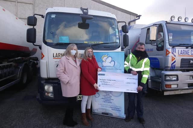 Graeme Humphrys, Larne Coal, Oil & Gas, presenting a cheque for £2010 to Vickie Shaw, manager and  Linda Boyd, assistant manager, both from The Oxygen Therapy Centre.