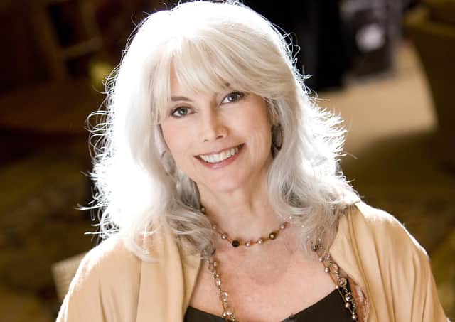 EmmyLou Harris, musician, holding Gibson Les Paul guitar with Coal River Mountain image on its face