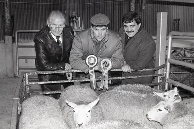 Alan Leckey from Castlederg, exhibitor of the supreme pen at the show and sale of prime lambs at Allam's Mart in Belfast in December 1988. Included are auctioneer George Clegg, left, and David Workman, agricultural, Northern Bank. Picture: Eddie Harvey/Farming Life archives