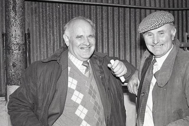 Pictured at the Allam's show and sale of prime lambs in Belfast in December 1988 are Jim Hunter (with cap) from Glenarm, exhibitor of the champion enjoys a laugh with one of the judges, Sammy Gibson from Sixmilecross. Picture: Eddie Harvey/Farming Life archives