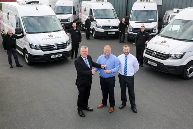 Jason Hamilton, managing director of Carnbrooke Meats, taking delivery of a new fleet of vans for the company’s extensive delivery services