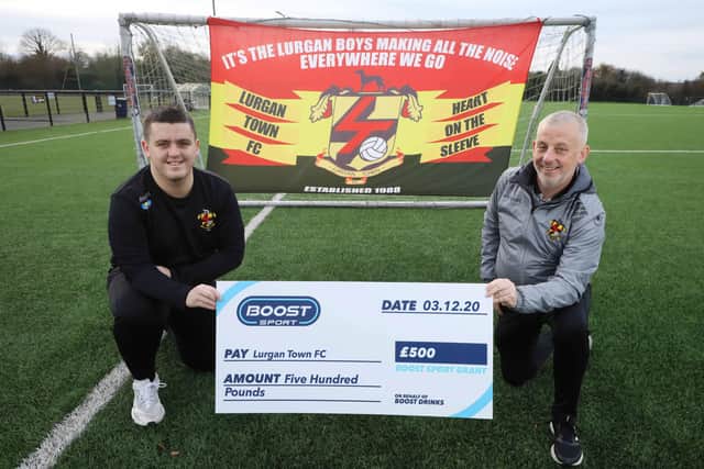 Philip McKinley and his son Lewis McKinley from Lurgan Town FC celebrate a win of £500 being awarded to the club as part of the Boost Sport Grant from Boost Drinks. Lurgan Town FC was awarded £500 to help achieve their goals after a very tough year in sport.