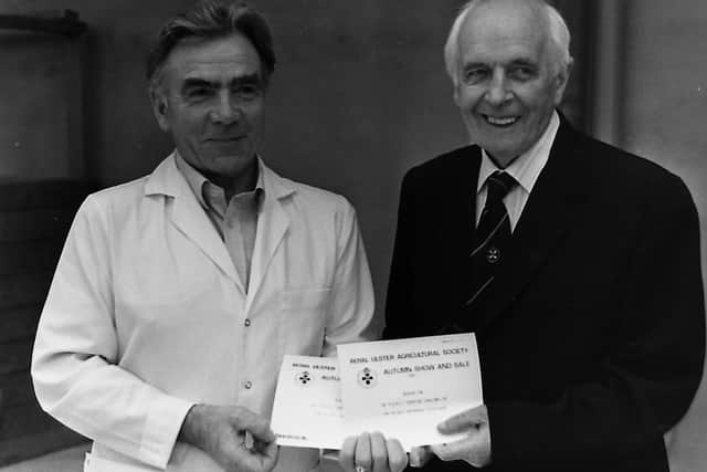 Bellaghy breeder Robert Overend, showed the reserve Red Star and performance tested champions at the autumn show and sale of pigs held at Balmoral in October 1989. He is pictured with RUAS president S Duffield Gibson. Picture: Randall Mulligan/Farming Life archives