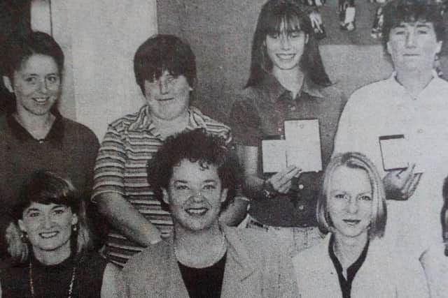 Miriam Uhlemann (Save the Children) presents First Aid and Baby Resuscitation Certificates to the latest recipients at Newtownabbey  High School 1997/