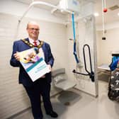Mayor of Antrim and Newtownabbey, Councillor Jim Montgomery is encouraging residents to have their say on the draft Disability Action Plan. He is pictured with resident Elaine McBride and her son Sam at the new Changing Places facility at The Gateway in Antrim