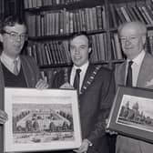 Linen Hall librarian John Gray, left, presenting a print of the White Linen Hall, Belfast, to the Lord Mayor of Belfast Nigel Dodds in December 1988. The White Hall was demolished to make way for the City Hall. The First Citizen was on a visit to the historic library to hand over as a reciprocal gesture a Charter centenary commemorative picture of the civic citadel. With him was town clerk Cecil Ward. Picture: News Letter archives