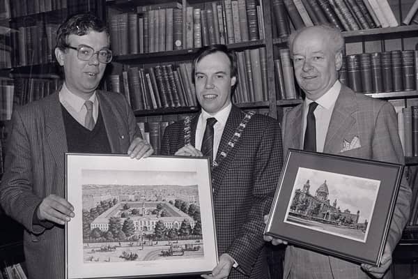 Linen Hall librarian John Gray, left, presenting a print of the White Linen Hall, Belfast, to the Lord Mayor of Belfast Nigel Dodds in December 1988. The White Hall was demolished to make way for the City Hall. The First Citizen was on a visit to the historic library to hand over as a reciprocal gesture a Charter centenary commemorative picture of the civic citadel. With him was town clerk Cecil Ward. Picture: News Letter archives