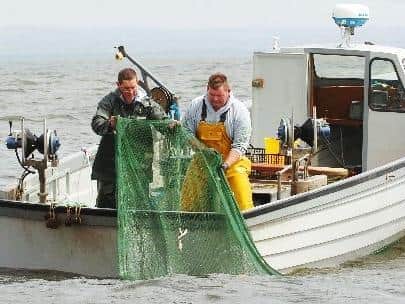 Fishing crew on Lough Neagh.
