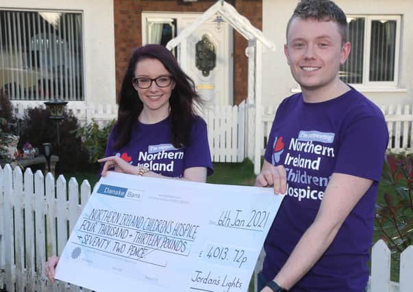 Jordan and Joanne Christie from Ballybogey with a cheque for £4013.72 for the NI Children's Hospice