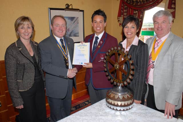 Larne Grammar School Deputy Head Boy Graham Boyd has won the Larne final of the Rotary International Youth Leadership Development competition. He is pictured receiving his award from Larne President Bill Liddle. With them are the Chairman of Youth Activities Sharon Gilbert, Graham's mum Karen Boyd and Vice President Dougie Bennett. Graham now goes on to the regional final in Coleraine.  LT47-308-PR