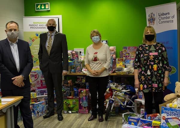 Pictured with the huge collection of toys are Evan Morton and Garry MacDonald from Lisburn Chamber and Roberta Marshall and Eilish Robinson from Barnardos NI.