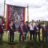 Members of LOL 783 Moneyrea with their old standard. Picture: News Letter archives